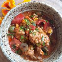 Kalderata · A hearty stew made with seitan, corn, peas, roasted peppers and green olives. Vegan. Allerge...