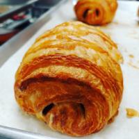 Chocolate Croissant · Made from scratch in house flaky croissant with dark chocolate batons.