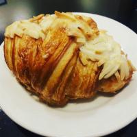 Almond Croissant · Twice baked croissant made from scratch in house over three days.  Filled and topped with al...