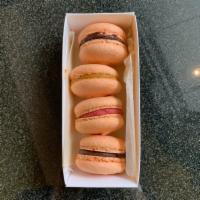 Box of 4 Macarons · Almond shell with dark chocolate or strawberry ganache filling.