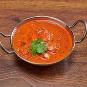 Butter Chicken Curry · Tandoori chicken cooked in a creamy sauce with butter.