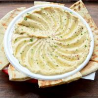 Original Hummus · A smooth blend of ground chickpeas, tahini sauce, lemon and a hint of garlic topped with oli...