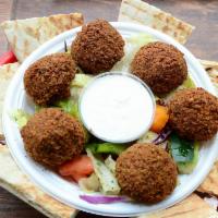 Falafel Appetizer · 6 pieces of falafels are served on a bed of house salad, with a side of tahini and a grilled...