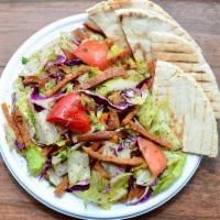 Fattoush Salad · Chopped lettuce, tomato, cucumber, pita chips, green and red pepper, sumac, mixed with olive...
