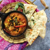 Goan Vindaloo · Spicy and tangy curry simmered with potatoes, colorful bell peppers, onions,
roasted cumin, ...