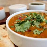 Chole Masala · Stewed chickpeas and red potatoes in our traditional curry sauce with spices.