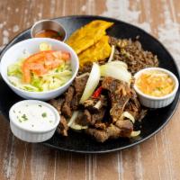 Taso Cabrit Comple · Fried goat. Served with salad. No Lunch on Weekends and Dinner starts after 3 PM.