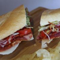 Capocollo Torpedo · Capocollo, lettuce, tomatoes, red onions, and Italian dressing with provolone cheese served ...
