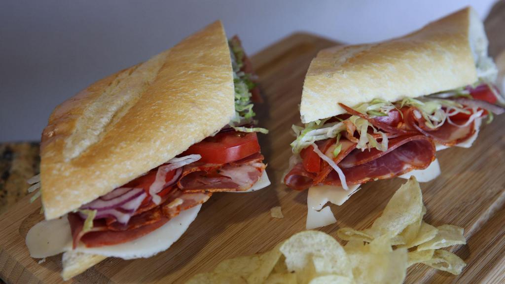 Capocollo Torpedo · Capocollo, lettuce, tomatoes, red onions, and Italian dressing with provolone cheese served COLD on a French baguette.