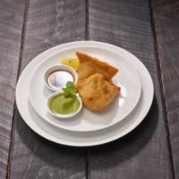 Vegetarian Samosa (2 Pieces) · Two pieces. Fried pastry turnovers filled with peas and potatoes. 