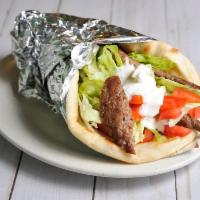 Spicy Gyro Wrap · Served with grilled onions, mushrooms, lettuce, tomatoes and tzatziki sauce.