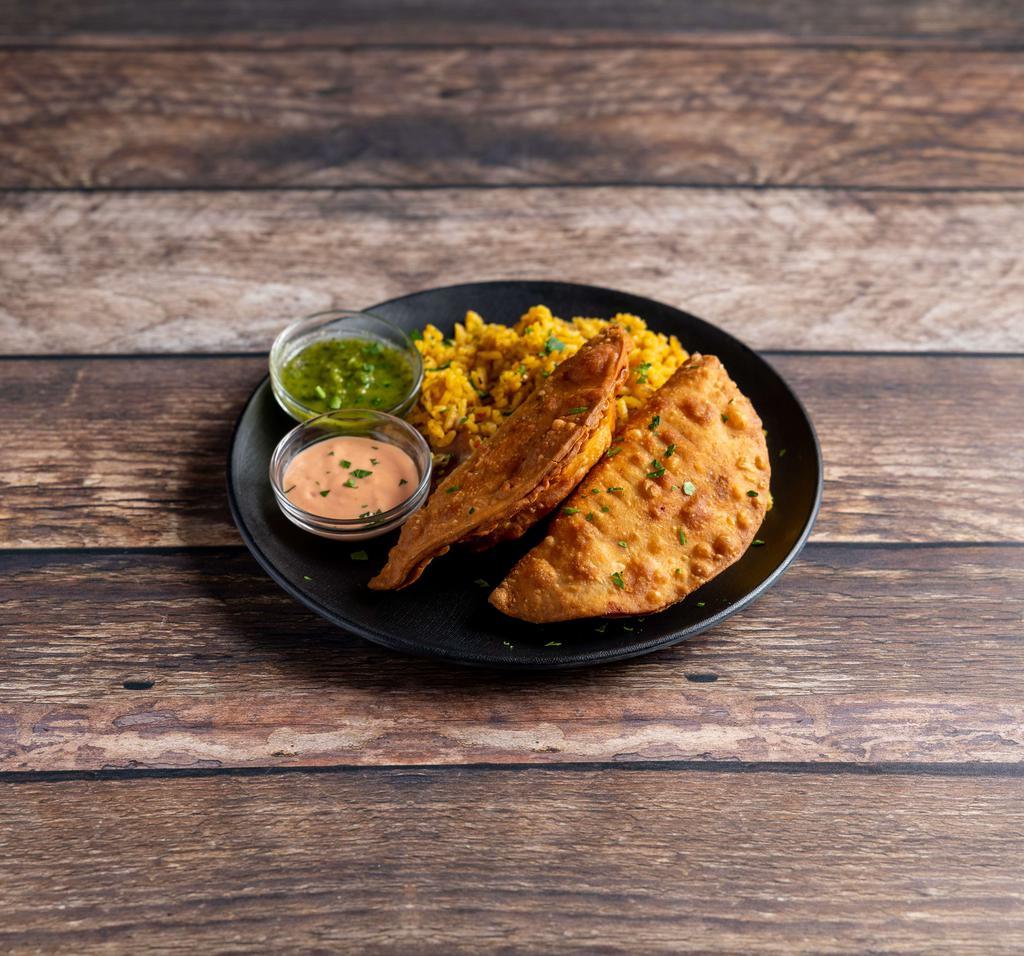 Choose Two Empanadas Basket · 2 empanadas with your choice of side.