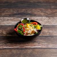 Mango Coconut Salad · Mango bits, bells peppers, onions, almonds and coconut shavings on a bed of spring mix lettu...