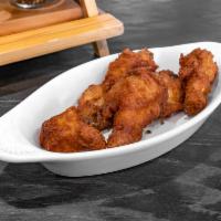 6 Pieces Wings  · Cooked wing of a chicken coated in sauce or seasoning.