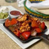 Mary's Chicken Breast Fajita · Tomatoes, poblano, onions, guacamole, crema, warm tortillas, Spanish rice and black beans. G...
