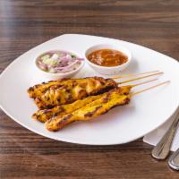 Chicken Satay (4) · 4 Grilled marinated chicken breasts with herb on skewers served with homemade peanut sauce a...