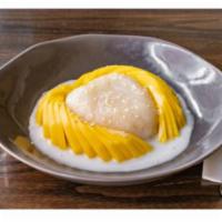Sweet Sticky Rice with Mango · Sticky rice served with coconut cream topping