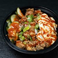 Kimchi Fried Rice and Egg Bowl · Kimchi fried rice, fried egg, and tangy cucumbers.