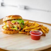 Nacho Burger ·  Lettuce, tomatoes, grilled onions & jalapeno, American, Swiss & Nacho cheese, turkey bacon,...