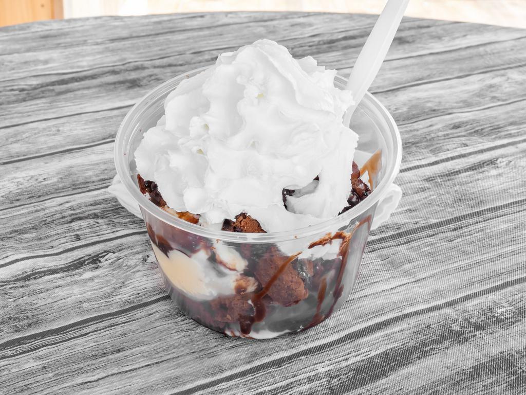 Hot Fudge Sundae · Chocolate brownie topped with fudge whip cream, nuts and ice cream.