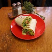 Buffalo Chicken Wrap · Grilled Buffalo chicken breast chopped with romaine lettuce, tomato,  crumbled blue cheese, ...