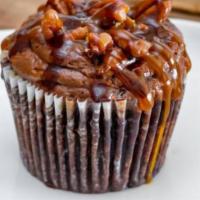 Caramel Sundae Cupcake · Caramel inserted and buttercream frosting. Served with chocolate, caramel drizzle and a cher...