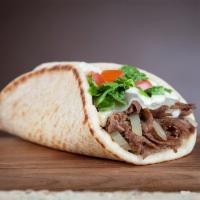 Steak and Cheese Wrap · Served with provolone, grilled onions, lettuce, tomatoes and creamy feta.