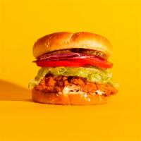 Fried Chicken Sandwich · Fried chicken with lettuce, tomato, pickles, onion and mayo on a fluffy bun.