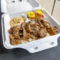 Beef Gyro Plate · Freshly shaved beef served over white basmati rice or seasoned fries with a small salad and ...