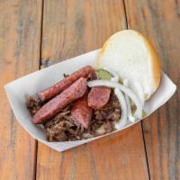 Big Neal's Sandwich · Chopped brisket, Meyer's sausage, pickles, onions, and sauce on a bun. Best of both worlds!