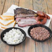 Family Meal · 2lbs of sliced brisket, 1lb of Meyer's sausage, 2 large sides (your choice), bread, pickles,...