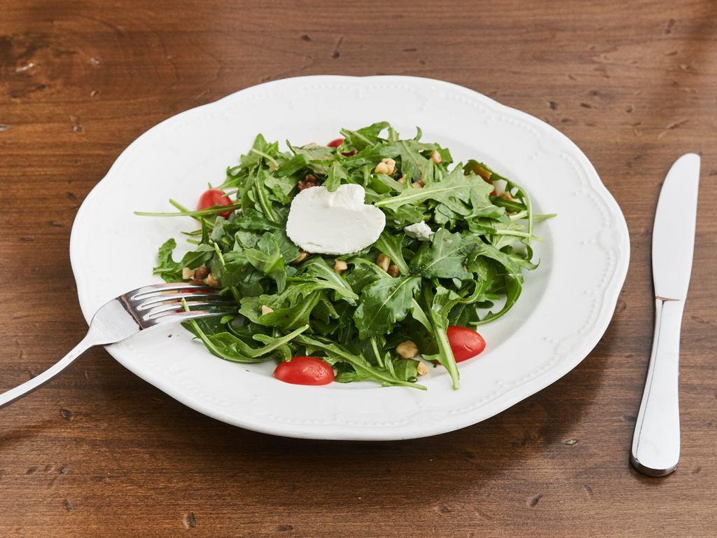 Arugula con Formaggio Salad · Baby arugula with goat cheeses and walnuts in olive oil dressing.