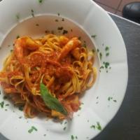 Fettuccini Sammarinese · Ribbons of pasta with shrimp, fresh basil and tomatoes.