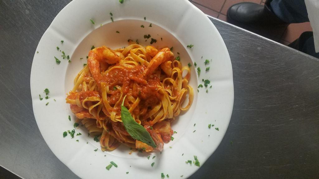 Fettuccini Sammarinese · Ribbons of pasta with shrimp, fresh basil and tomatoes.