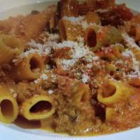 Rigatoni Bolognese · Tuscan meat style sauce finished with grated Parmesan cheese.