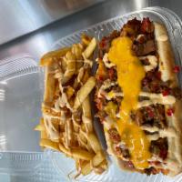 Philly Cheese Dog · Philly steak, bell pepper, onions, and cheese. Fries included.