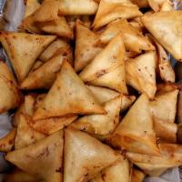 Chicken Samosa · A fried pastry with a savory potato filling.