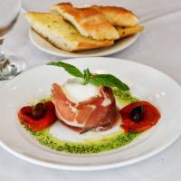 Burrata · Apulian creamy mozzarella, proscuitto and fire roasted bell peppers.