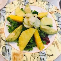 Tropical Salad · Baby greens, avocado, pineapple, mango, hearts of palm and coconut vinaigrette.
