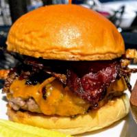 Texas Burger Combo · Ground Beef, Crispy Bacon, Crispy Onions, BBQ Sauce & Vermont Cheddar. Served with Curly Fri...
