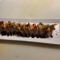 Ninja Roll · Shrimp, seared salmon, crab salad, eel sauce, tobiko and green onions.