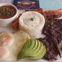 Bandeja Ecuatoriana/Ecuadorian Tray · Chicharron, Carne Asada, 2 Huevos, Aguacate, Frijoles у Platano Frito.