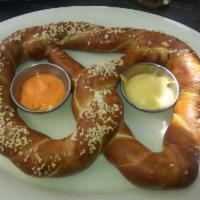 Pub Pretzel · Served with your choice of homemade cheese sauce or Dijon honey mustard.