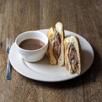 Charley's Signature French Dip Sandwich · Roast beef with provolone cheese, fried onions, on garlic bread and au jus for dipping.