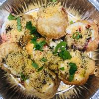 Dahi Sev Puri · Mini puri stuffed with chickpeas, potatoes and spiced yogurt.