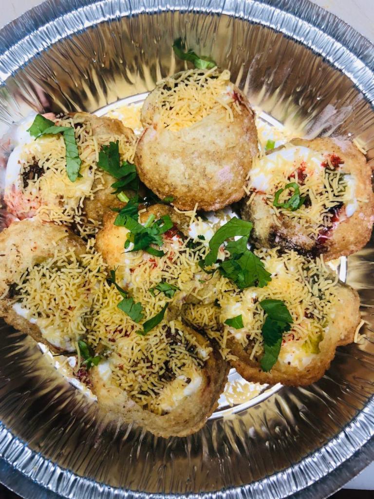 Dahi Sev Puri · Mini puri stuffed with chickpeas, potatoes and spiced yogurt.