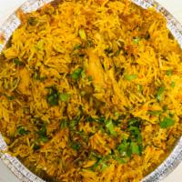 Chicken Biryani · Basmati rice slow cooked and layered with chicken.