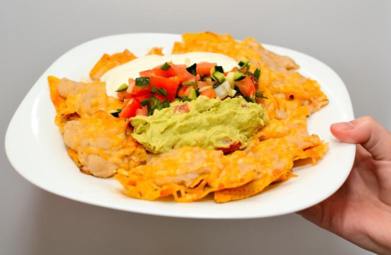 Nachos Supreme · Ground beef, black beans, sour cream, guacamole topped with cheese (Add chicken $3)