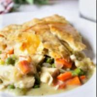 Chicken Pot Pie · Chunks of chicken breast, onions & mushrooms, peas & carrots topped with puff pastry
