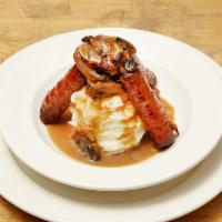 Bangers and Mash · Irish sausages with whipped potatoes, sauteed onions & gravy
